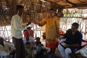 Mittal Patel giving Ration Card to Nomadic Tribes